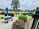 Grilling and picnic area with golf course views surrounded by lush landscape at 4783 Wild Iris Dr. # 101, Myrtle Beach, SC 29577