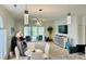 Inviting living area with modern lighting, a wall-mounted TV, and sliding glass doors to the outdoor space at 4783 Wild Iris Dr. # 101, Myrtle Beach, SC 29577