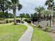 Picnic area with tables, chairs and grill overlooking lush green golf course at 4783 Wild Iris Dr. # 101, Myrtle Beach, SC 29577