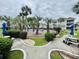 View of the community pool and picnic areas surrounded by lush landscaping and condominium buildings at 4783 Wild Iris Dr. # 101, Myrtle Beach, SC 29577