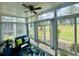 Relaxing sun room featuring floor to ceiling windows with wooded backyard views at 4783 Wild Iris Dr. # 101, Myrtle Beach, SC 29577