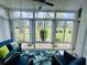 Bright sun room with nature view through large windows at 4783 Wild Iris Dr. # 101, Myrtle Beach, SC 29577