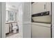 Bathroom featuring a toilet, sink, cabinets, and a stacked washer and dryer at 501 Maison Dr. # G-14, Myrtle Beach, SC 29572