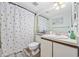 Bathroom with toilet, tub-shower, sink with vanity, and polka dot shower curtain at 501 Maison Dr. # G-14, Myrtle Beach, SC 29572