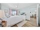 Bedroom with light wood floors, access to a balcony, and adjoining living area at 501 Maison Dr. # G-14, Myrtle Beach, SC 29572