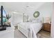 Bright bedroom features a queen bed, ceiling fan, and light wood flooring at 501 Maison Dr. # G-14, Myrtle Beach, SC 29572