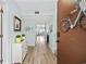 Entryway with light blue walls, wood floors, and decor at 501 Maison Dr. # G-14, Myrtle Beach, SC 29572