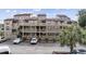 Condominium complex featuring multiple stories, private balconies, and ample parking at 501 Maison Dr. # G-14, Myrtle Beach, SC 29572