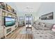 Bright living room featuring comfortable seating, stylish decor, and a view of the outside from the sliding glass door at 501 Maison Dr. # G-14, Myrtle Beach, SC 29572