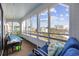 Enclosed porch with seating offering relaxing views of the surroundings and marsh at 501 Maison Dr. # G-14, Myrtle Beach, SC 29572