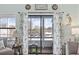 Inviting balcony view showcasing serene landscape and nearby buildings, with decorative curtains adding charm at 501 Maison Dr. # G-14, Myrtle Beach, SC 29572