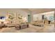 Open-concept living space with stylish furnishings, wood floors, and views of the dining area at 519 Magnolia Terrace Dr, Myrtle Beach, SC 29579