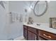 Half bathroom featuring dark wooden cabinets, a white countertop sink, and decorative shell accents at 520 Chapman Loop, Pawleys Island, SC 29585