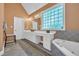 Bright bathroom with double vanity, a glass block window, and a soaking tub at 520 Chapman Loop, Pawleys Island, SC 29585
