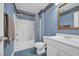 Bathroom featuring blue walls, a bathtub/shower combo, and a vanity with a white sink at 520 Chapman Loop, Pawleys Island, SC 29585