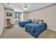 Bedroom featuring twin beds with blue comforters, a window view, and a rocking chair at 520 Chapman Loop, Pawleys Island, SC 29585