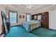 Cozy main bedroom suite featuring neutral walls, built in shelves, and plush green carpet at 520 Chapman Loop, Pawleys Island, SC 29585