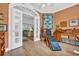 Warm, light-filled office space adjacent to living area through arched doorway with double doors at 520 Chapman Loop, Pawleys Island, SC 29585