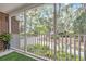 Relaxing porch with view of the landscaped yard and mature trees at 520 Chapman Loop, Pawleys Island, SC 29585