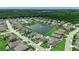 A high aerial view captures a well-planned residential area around a tranquil pond with a fountain at 5406 Longhorn Dr., Myrtle Beach, SC 29588