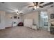 Spacious room with ceiling fans, neutral carpet, and entry to bathroom, creating a versatile living space at 5406 Longhorn Dr., Myrtle Beach, SC 29588
