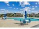 A community pool area includes a spacious pool with seating and umbrellas, perfect for relaxation and socializing at 5406 Longhorn Dr., Myrtle Beach, SC 29588