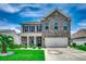 Charming two-story home with brick and siding, complemented by a well-manicured lawn and garden at 5406 Longhorn Dr., Myrtle Beach, SC 29588
