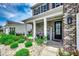 Inviting front porch adorned with lush landscaping and a welcoming 'Welcome' sign at 5406 Longhorn Dr., Myrtle Beach, SC 29588