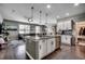 Open-concept kitchen with granite island, stainless steel appliances, and view of living room at 5406 Longhorn Dr., Myrtle Beach, SC 29588