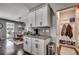 Well-equipped kitchen with white cabinets, granite countertops, and convenient mudroom access at 5406 Longhorn Dr., Myrtle Beach, SC 29588