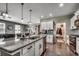 Bright kitchen with island sink, stainless steel appliances, and view of the living area at 5406 Longhorn Dr., Myrtle Beach, SC 29588