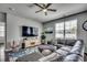 Cozy living room with a comfortable leather sofa, TV, and decorative rug over hardwood floors at 5406 Longhorn Dr., Myrtle Beach, SC 29588
