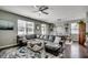 Comfortable living room with large sectional sofa and dining area in background at 5406 Longhorn Dr., Myrtle Beach, SC 29588