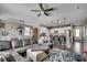 Open-concept living room showcasing the kitchen, dining area, and comfortable seating arrangement with hardwood floors at 5406 Longhorn Dr., Myrtle Beach, SC 29588