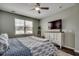 Comfortable bedroom featuring a full bed, white dresser, and a ceiling fan over hardwood floors at 5406 Longhorn Dr., Myrtle Beach, SC 29588