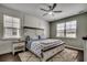 Bright bedroom with a king-sized bed, wooden headboard, lots of natural light, and plush rug at 5406 Longhorn Dr., Myrtle Beach, SC 29588