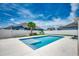 Backyard oasis showcasing a sparkling pool, sun shelf, and a well-maintained yard, perfect for outdoor entertainment at 5406 Longhorn Dr., Myrtle Beach, SC 29588