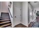 Modern staircase with hardwood steps and black handrail at 5406 Longhorn Dr., Myrtle Beach, SC 29588