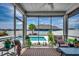 Screened porch offering a clear view of the beautiful pool area, extending the home's living space at 5406 Longhorn Dr., Myrtle Beach, SC 29588