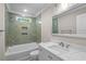 The bathroom has a marble-look vanity, brushed nickel fixtures, and a tiled shower and tub, with a modern mirror at 6001 - 1793 S Kings Hwy., Myrtle Beach, SC 29575
