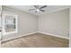 Neutral bedroom featuring a ceiling fan, hardwood floors, a large window, and natural lighting at 6001 - 1793 S Kings Hwy., Myrtle Beach, SC 29575