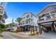 Bright blue, multi-story beach home with multiple decks and black support beams at 6001 - 1793 S Kings Hwy., Myrtle Beach, SC 29575