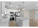 Stylish kitchen featuring white cabinets, marble countertops, stainless steel appliances, and a kitchen island at 6001 - 1793 S Kings Hwy., Myrtle Beach, SC 29575