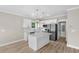 Modern kitchen with white cabinets, marble countertops and stainless steel appliances plus a center island at 6001 - 1793 S Kings Hwy., Myrtle Beach, SC 29575