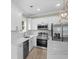 Bright kitchen featuring white cabinets, marble countertops and stainless steel appliances at 6001 - 1793 S Kings Hwy., Myrtle Beach, SC 29575
