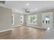 Bright living room with wood floors, neutral color walls and trim and windows offering an outdoor view at 6001 - 1793 S Kings Hwy., Myrtle Beach, SC 29575