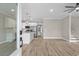 Open-concept living room featuring wood floors, white trim, stairs and an eat-in kitchen with stainless appliances at 6001 - 1793 S Kings Hwy., Myrtle Beach, SC 29575