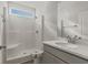 Modern bathroom with stand-up shower, granite countertop vanity, and large mirror at 61 Yale Pl., Pawleys Island, SC 29585