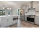 This kitchen boasts stainless steel appliances, a large island and gray cabinets at 61 Yale Pl., Pawleys Island, SC 29585
