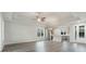 Bright living room showcasing an open floor plan to the kitchen with stainless appliances at 61 Yale Pl., Pawleys Island, SC 29585
